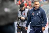 11 May 2024, Berlin: Soccer: Bundesliga 2, Hertha BSC - 1. FC Kaiserslautern, matchday 33, Olympiastadion. Hertha BSC coach Pal Dardai on his way to the interview. Photo: Andreas Gora/dpa - IMPORTANT NOTE: In accordance with the regulations of the DFL German Football League and the DFB German Football Association, it is prohibited to utilize or have utilized photographs taken in the stadium and/or of the match in the form of sequential images and/or video-like photo series