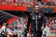 11 May 2024, Bavaria, Nuremberg: Soccer: Bundesliga 2, 1. FC Nürnberg - SV Elversberg, matchday 33 at the Max Morlock Stadium. Nuremberg coach Cristian Fiel arrives on the pitch before the start of the match. Photo: Daniel Karmann/dpa - IMPORTANT NOTE: In accordance with the regulations of the DFL German Football League and the DFB German Football Association, it is prohibited to utilize or have utilized photographs taken in the stadium and/or of the match in the form of sequential images and/or video-like photo series