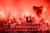 10 May 2024, Augsburg: Stuttgart fans cheer on their team in Augsburg, with a banner celebrating the club