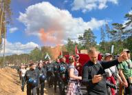 11 May 2024, Grünheide: German police officers accompany hundreds of demonstrators, around a thousand according to police sources, who took part in a protest march today to the factory that the U.S. electric car manufacturer Tesla has in Grünheide, on the outskirts of Berlin. Photo: Alina Schmidt/dpa