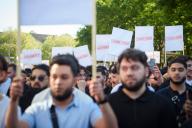 11 May 2023, Hamburg: Demonstrators hold up signs with the words "Forbidden", "Censored" and "Censored" at a rally organized by the Islamist network Muslim Interactive in Hamburg