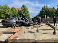 12 May 2024, Mecklenburg-Western Pomerania, Ludwigslust: The bronze equestrian monument "Riding Alexandrine" lies on the ground after a car drove into it on the traffic circle. The monument on Alexandrinenplatz depicts the Grand Duchess of Mecklenburg-Schwerin. Photo: Iris Leithold/dpa-Zentralbild/dpa - ATTENTION: Person(s) has/have been pixelated for legal reasons