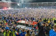 dpatop - 11 May 2024, Kiel: Players and fans celebrate the club