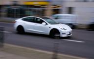 05 April 2024, Berlin: 05.04.2023, Berlin. A Tesla Model 3 drives along a road (dragged shot with longer exposure time). The Tesla Model 3 is the best-selling electric car in the world. Photo: Wolfram Steinberg/dpa Photo: Wolfram Steinberg/dpa