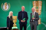 13 May 2024, Berlin: Soccer: DFB Cup, Cup Handover DFB Cup 2024 in the Rotes Rathaus. Bernd Neuendorf (r), President of the German Football Association (DFB), Perry Bräutigam (M), Club Representative RB Leipzig, and Iris Spranger (SPD), Senator for the Interior and Sport of Berlin, stand on stage during the handover of the trophy before the 81st DFB Cup final. Photo: Monika Skolimowska/dpa - IMPORTANT NOTE: In accordance with the regulations of the DFL German Football League and the DFB German Football Association, it is prohibited to utilize or have utilized photographs taken in the stadium and/or of the match in the form of sequential images and/or video-like photo series