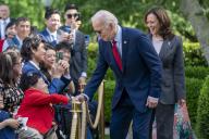 United States President Joe Biden, with Vice President Kamala Harris, arrives to deliver remarks during a reception celebrating Asian American, Native Hawaiian, and Pacific Islander Heritage Month in the Rose Garden the White House in Washington, DC, USA, 13 May 2024. Credit: Shawn Thew / Pool via CNP