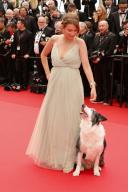 Laura Martin Contini and Messi the dog attends the premiere of \'Le Deuxieme Acte ("The Second Act")\' and opening ceremony of the 77th Cannes Film Festival at Palais des Festivals in Cannes, France, on 14 May 2024