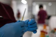 15 May 2024, Baden-Württemberg, Stuttgart: A nurse is drawing up a syringe in a hospital ward. Photo: Marijan Murat\/dpa