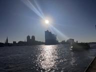 15 May 2024, Hamburg: The sun rises over the Elbphilharmonie concert hall. Another beautiful early summer