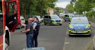 15 May 2024, North Rhine-Westphalia, Wachtberg: A contingent of police is deployed at a school in Wachtberg. According to investigators, there had previously been a knife attack in a neighboring hostel on Wednesday. (to dpa: "Major police operation at school in Wachtberg") Photo: Axel Vogel/dpa