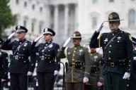 Members of law enforcement salute during the National Peace Officers Memorial Service at the U.S. Capitol in Washington, DC on Wednesday, May 15, 2024. Credit: Bonnie Cash / Pool via CNP