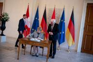16 May 2024, Berlin: Viola Amherd, President of the Swiss Confederation, signs the guest book alongside President Frank-Walter Steinmeier at Bellevue Palace. Photo: Fabian Sommer/dpa