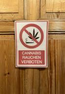 PRODUCTION - 26 April 2024, Thuringia, Meiningen: A sign reading "Cannabis smoking prohibited" hangs on a door. Photo: Gregor Tholl/dpa
