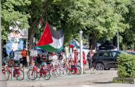15 May 2024, Hamburg: A large Palestinian flag hangs above the entrance to the Hamburg Palestine Solidarity Camp near the university on Moorweide. Photo: Markus Scholz\/dpa