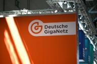 14 May 2024, North Rhine-Westphalia, Cologne: Logo, lettering Deutsche GigaNetz at a stand at Anagacom, Europe