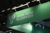 14 May 2024, North Rhine-Westphalia, Cologne: Logo, lettering Our Green Fiber UGG, a nationwide fiber optic infrastructure company at a stand at Anagacom, Europe