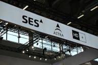 14 May 2024, North Rhine-Westphalia, Cologne: Logo, lettering of SES ASTRA, a Luxembourg satellite operator, on a stand at Anagacom, Europe