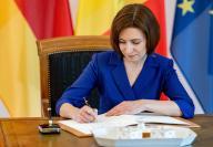17 May 2024, Berlin: Maia Sandu, President of the Republic of Moldova, signs the guest book at Bellevue Palace. Photo: Fabian Sommer/dpa