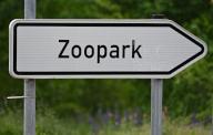 PRODUCTION - 17 May 2024, Thuringia, Erfurt: A signpost points the way to the Thuringian Zoo Park. In many zoos, animal parks and animal sanctuaries in Thuringia, admission prices have been increased in recent years to counter cost pressures. Photo: Martin Schutt/dpa