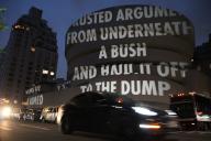 16 May 2024, USA, New York: Visitors stand in front of the installation "For the Guggenheim" by artist Jenny Holzer, which is projected onto the exterior façade of New York