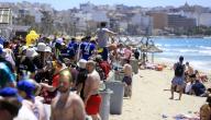 17 May 2024, Spain, Palma: People sunbathe on the Arenal beach in Mallorca before the Whitsun weekend. Photo: Clara Margais/dpa