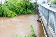 17 May 2024, Baden-Württemberg, Lahr: After rainfall, muddy, brown water fills the Schutter in Lahr. The weather service had warned of flash floods, landslides and flooding. Cellars did indeed fill up, but "Katinka" caused only minor damage. Photo: Philipp von Ditfurth/dpa