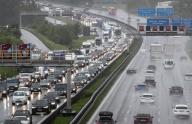 17 May 2024, Baden-Württemberg, Stuttgart: Cars and trucks jam on the A8 highway near Stuttgart Airport when it rains. Photo: Christoph Schmidt/dpa