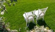SYMBOL - 10 May 2024, Baden-Württemberg, Rottweil: Two chairs with floral decorations before the start of an outdoor wedding ceremony at a wedding location. Photo: Silas Stein\/dpa