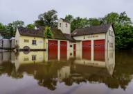 19 May 2024, Saarand, Blieskastel: The fire station in the Breitfurt district is under water. The water level of the Blies, a tributary of the Saar, is currently falling and the fire department has largely pumped out the historic old town of Blieskastel. Photo: Andreas Arnold/dpa