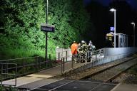 18 May 2024, Bavaria, Kleinheubach: Rescue workers stand on a platform in Kleinheubach. Kleinheubach (dpa) - Two men have died in a train accident in Lower Franconia. The two men, aged 22 and 37, fell between the carriages of an approaching train at the station in Kleinheubach (Miltenberg district) on Saturday evening, fell into the track bed and were fatally injured, police said on Sunday. According to the current state of the investigation, the men were alone on the platform. Photo: Ralf Hettler/dpa