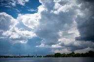 19 May 2024, Hamburg: Clouds gather over the Outer Alster. Photo: Daniel Bockwoldt/dpa
