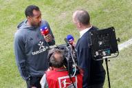 19 May 2024, North Rhine-Westphalia, Duesseldorf: Soccer: Bundesliga 2, Fortuna Düsseldorf - 1. FC Magdeburg, matchday 34, in the Merkur Spiel-Arena. Düsseldorf coach Daniel Thioune (l) gives an interview before the start of the match. Photo: Roland Weihrauch/dpa - IMPORTANT NOTE: In accordance with the regulations of the DFL German Football League and the DFB German Football Association, it is prohibited to utilize or have utilized photographs taken in the stadium and/or of the match in the form of sequential images and/or video-like photo series