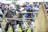 19 May 2024, Mecklenburg-Western Pomerania, Rostock: Knights in a show fight at the medieval spectacle in Rostock