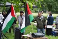 20 May 2024, Hesse, Frankfurt/Main: Participants set up a pro-Palestinian protest camp on the campus of Goethe University. The camp was approved on a green space under certain conditions. Photo: Boris Roessler/dpa