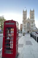 PRODUCTION - 18 April 2024, Great Britain, London: A red telephone box stands in front of Westminster Abbey. Photo: Benedikt von Imhoff/dpa
