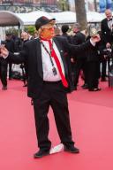 A Donald Trump impersonator poses at the premiere of 
