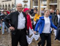 21 May 2024, Luxembourg, Echternach: Bishop Stephan Ackermann (l) of Trier jumps with pilgrims at the traditional jumping procession in the Luxembourg border town of Echternach. St. Willibrord (658-739) is venerated with the jumping procession. The 500-year-old pilgrimage has been part of UNESCO