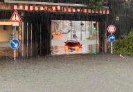 21 May 2024, Bavaria, Gößweinstein: A car stands in a flooded underpass. Heavy rainfall has caused flooded cellars and streets in Upper Franconia. Photo: News5 / Ferdinand Merzbach/NEWS5/dpa