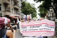 22 May 2024, Berlin: Participants hold a banner with the text "Youth - Future - Socialism Against Fascism, Apartheid & War!" during the demonstration "School Strike for Palestine" in front of the Rütli School in Neukölln. Photo: Carsten Koall/dpa