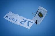 23 May 2024, Berlin: Parachutists of the Federal Police with "75 years" flag above the state ceremony for "75 years of the Basic Law" on the forum between the Bundestag and the Federal Chancellery. The Basic Law of the Federal Republic of Germany was proclaimed on May 23, 1949 and came into force the following day. The anniversary will be celebrated with a three-day democracy festival from 24 to 26 May 2024 in Berlin