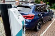 31 August 2023, Bremen: A BMW electric car is charged at an Eulektro charging station in a parking lot in the city center. The company Eulektro operates numerous charging stations in the Bremen city area. Photo: Hauke-Christian Dittrich/dpa