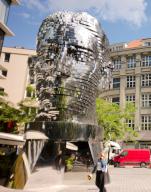 21 May 2024, Czech Republic, Prag: A moving sculpture in front of the Quadrio shopping and office center has been commemorating the writer Franz Kafka (1883-1924) since 2014. The rotating head is the work of Czech artist David Cerny. Franz Kafka died 100 years ago on 03.06.2024. Photo: Michael Heitmann/dpa