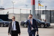 23 May 2024, Brandenburg, Schönefeld: Christian Lindner (r, FDP), Federal Minister of Finance, walks to a government plane on the military section of BER Berlin-Brandenburg Airport. The Federal Minister of Finance is traveling to Italy to attend the meeting of the G7 finance ministers. Photo: Hannes P. Albert/dpa