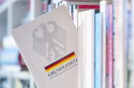 13 May 2024, ·······: The Basic Law of Germany (German constitution) stands on a bookshelf. Photo: dpa Photo: Hendrik Schmidt/dpa