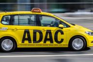 23 May 2024, Saxony, Dresden: An ADAC vehicle for roadside assistance drives through the city center. (Shot with long exposure time) Photo: Robert Michael/dpa