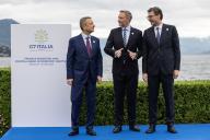 24 May 2024, Italy, Stresa: Fabio Panetta (l-r), Governor of the Bank of Italy, Christian Lindner (FDP), Federal Minister of Finance, and Giancarlo Giorgetti, Italian Minister of Economy and Finance, talk on Lake Maggiore. This year, Italy is chairing the Group of Seven of important Western industrialized nations. Photo: Hannes P. Albert/dpa