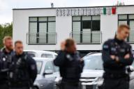25 May 2024, North Rhine-Westphalia, Marl: Police officers stand outside the venue of the AfD federal association