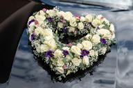 SYMBOL - 24 May 2024, Baden-Württemberg, Rottweil: Flower decorations in the shape of a heart are attached to the hood of a wedding car. Photo: Silas Stein/dpa