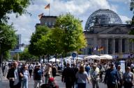 26 May 2024, Berlin: Visitors walk through the Democracy Festival to mark the 75th anniversary of the Basic Law. Photo: Michael Kappeler/dpa