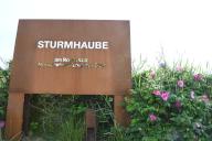 26 May 2024, Schleswig-Holstein, Kampen: The sign for the "Sturmhaube" restaurant in Kampen on Sylt. Photo: Lea Sarah Albert/dpa